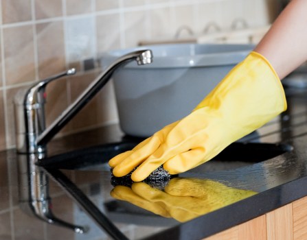 Professional carpets cleaner in W1 treating a living room carpet