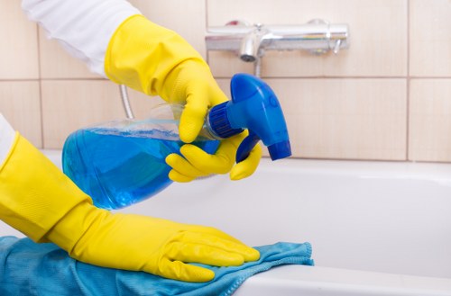 Technician applying safe carpet cleaning treatment in a domestic property