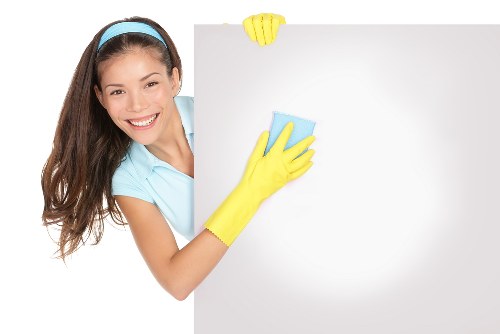 Cleaning machine in use with attention to electrical and water safety